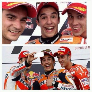 Marc Marquez celebrates his victory with a podium 'selfie' with Pedrosa and Dovi.